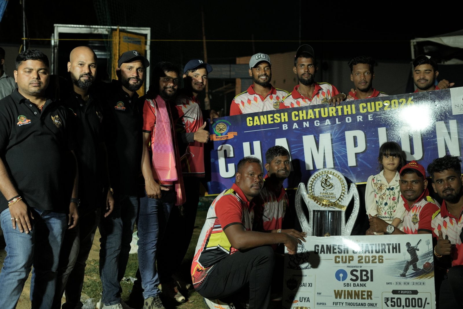 Celebrating together with the championship trophy