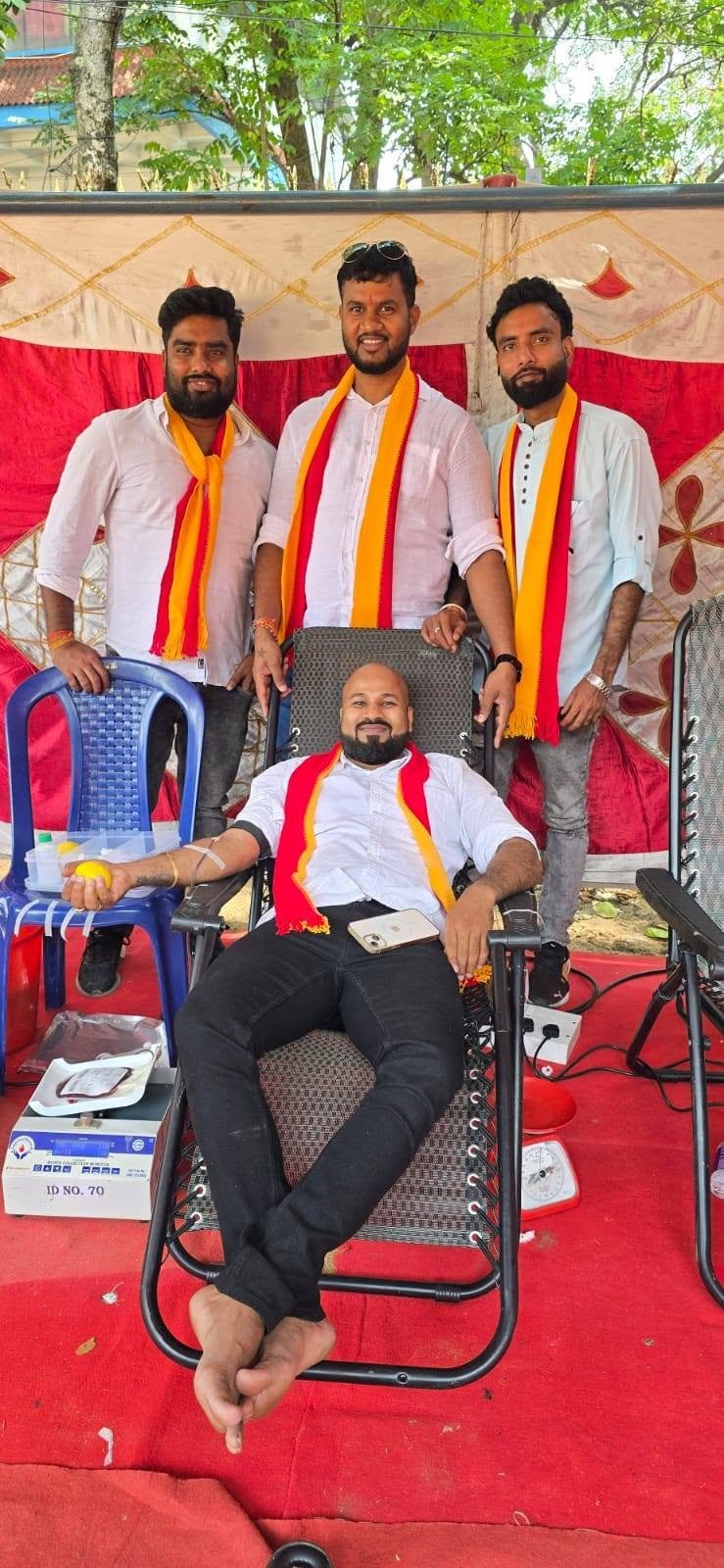 A donor participating with community members present